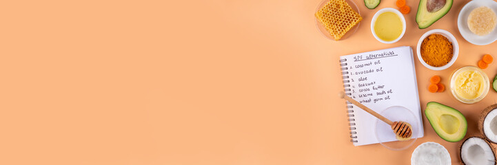 DIY Natural Sunscreen Alternative, Anti-Sunscreen Movement. Natural organic SPF ingredients background with olive oil, coconut oil, cocoa butter, aloe gel, beeswax, carrot seed oil