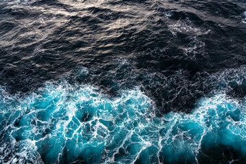 Water splash by a ship side, top view