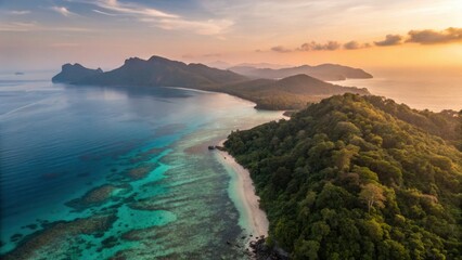 Fototapeta premium Koh Kradan Paradise Beach Island Trang Thailand Andaman Sea A stunning aerial view of a tropical coastline with lush green hills and calm turquoise waters.