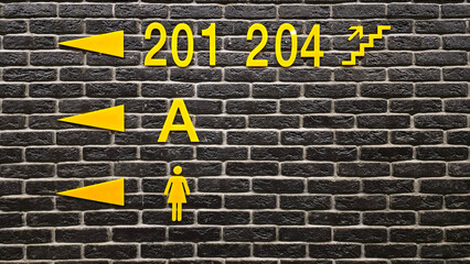 yellow  signs on brick wall
