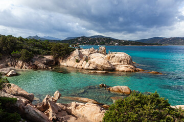 Turquoise waters meet rocky shores near San Teodoro, Sardinia. A Mediterranean paradise with...