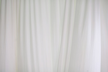 The white curtains are soft and wavy.