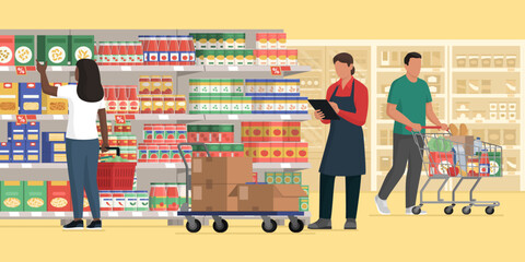 Customers buying groceries at the supermarket and stock clerk checking products