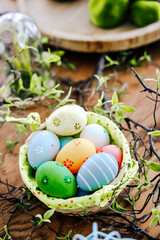 Colorful Easter eggs arranged in a decorative basket during springtime celebration
