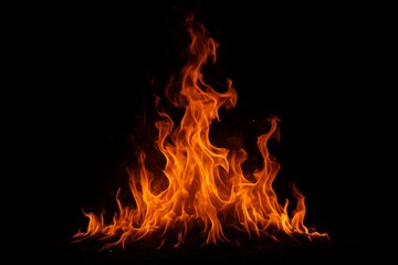 Fototapeta premium Bonfire blazing against a dark backdrop, radiating warmth and inviting glow as flames dance upward in captivating, mesmerizing patterns, creating an enchanting atmosphere