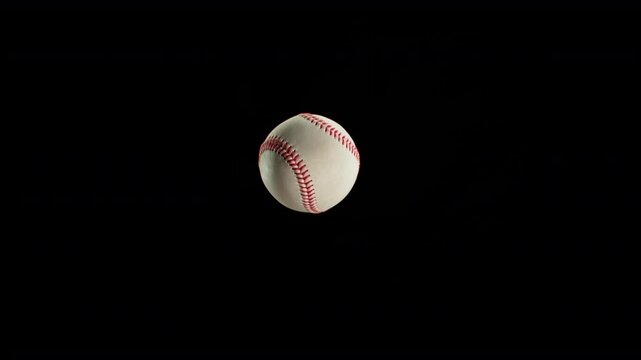 Baseball Ball Flying and Rotating in Super Slow Motion on Black Background, 1000 fps.