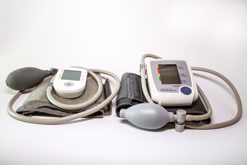 Two semi-automatic digital devices for measuring blood pressure and pulse (tonometer) of different designs.