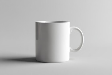 Obraz premium A plain white ceramic mug is displayed on a neutral backdrop