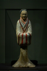old man with a bell in his hand