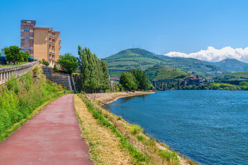 Fototapeta premium Path by Douro River Peso da Regua Portugal near the two bridges tourist attraction