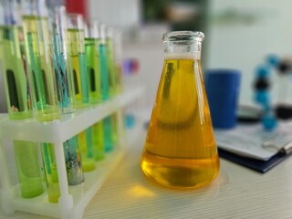 Chemicals or petroleum products in flask in laboratory. Quality control of oil and petroleum...