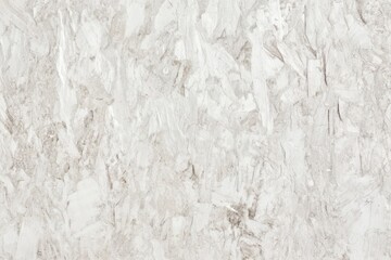 Horizontal view of a light-toned OSB board with soft white and grey hues, emphasizing the rough yet structured appearance of the pressed wood strands with clear details of texture.
