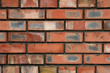 Background of brick wall, brick wall splattered with concrete. Brickwork.