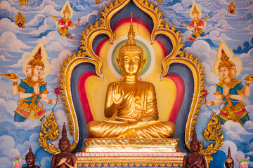 Fototapeta premium The Golden Buddha Statue is surrounded by divine imagery that captivates the viewer