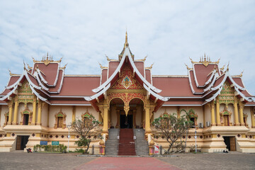 Naklejka premium Experience the stunning and magnificent Golden Stupa located at Wat That Luang in Vientiane, Laos