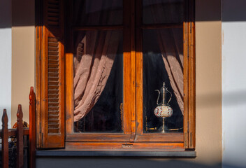 Windows in houses of traditional architecture in the mountain tourist village of Metsovo in the mountains of Epirus in Greece