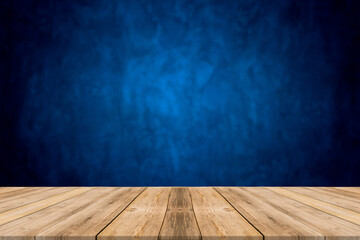 Wood table top on blue gradient abstract background - can be used for display or montage your products