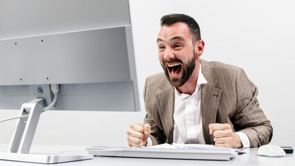 A happy businessman receives an incredible opportunity, news or reward with a message on his...