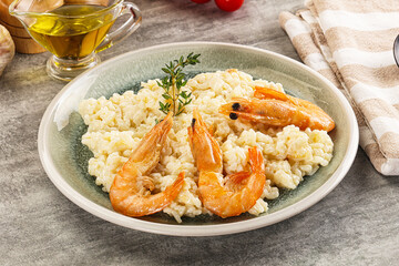 Italian risotto with prawn served thyme