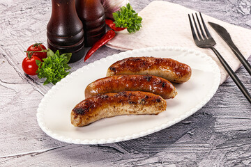 Delicous natural roasted sausages in the plate