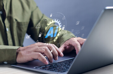 Cyber ​​fraud or AI technology alert concept, businessman using computer to access information on internet, showing warning about using AI technology to access malicious software or threats