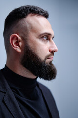 Obraz premium Studio portrait of young handsome man with beard.