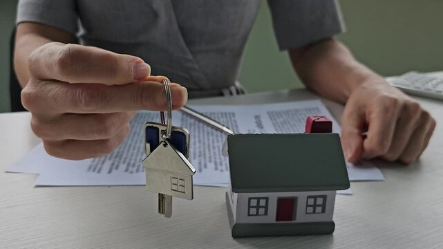 Signing documents and handing over keys during a home purchase process