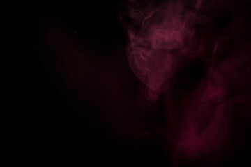 Ethereal Swirls of Vibrant Purple Smoke Against a Dark Background