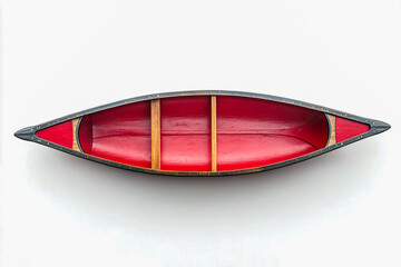 Obraz premium Photograph of a red canoe on a white background, isolated with no shadows, in a top-down view