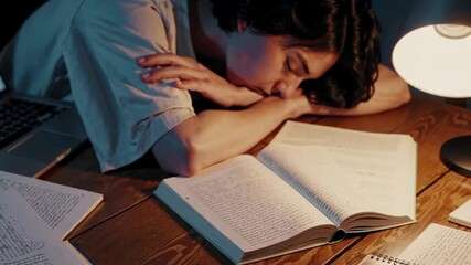 Tired student taking a break with desk & lamp. Mental balance, study fatigue management & mindful rest for academic wellness & intellectual health improvement.