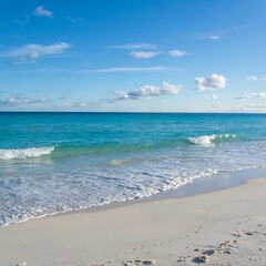 Obraz premium A breathtaking view of a pristine white sand beach meeting a vibrant turquoise ocean.