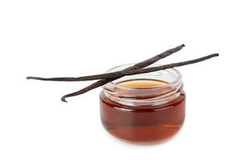 Vanilla extract in glassware isolated on white background. Vanilla extract for baking and desserts. Aromatic Homemade Vanilla Extract. Close -up. Place for the text. Copy space.