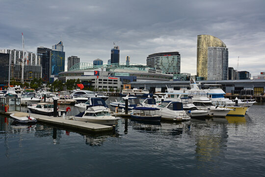Melbourne, Australia &ndash; February 28, 2015. Docklands district in Melbourne, at dusk. View toward Etihad Stadium, with commercial and residential buildings and boats.