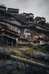 Wangxian Valley, 08 Dec 2024 China, Scenic mountain cliffside path view, surrounded by nature and forest. This travel destination features natural beauty remote village, and traditional architecture.