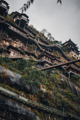 Wangxian Valley, 08 Dec 2024 China, Scenic mountain cliffside path view, surrounded by nature and forest. This travel destination features natural beauty remote village, and traditional architecture.