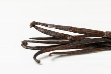 Vanilla pods on a textured background. Vanilla flowers and seeds. vanilla stick bean. Aromatic...