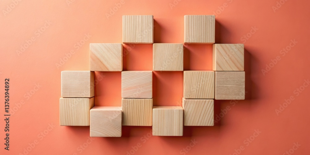 Leinwandbilder a collection of unfinished wooden blocks arranged in an abstract pattern on a coral background