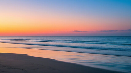 Beautiful sunset paints the ocean horizon with evening light, reflecting on the wet sand