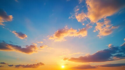 Obraz premium Scenic Sunset Sky with Golden Light and Clouds in Blue Sky