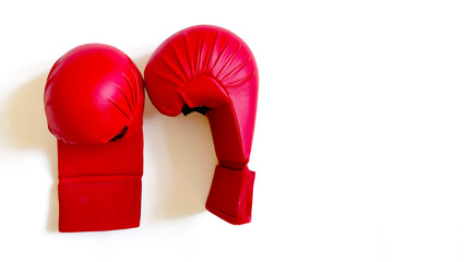 Red karate gloves isolated on white background with copy space. Martial arts, sportswear and...