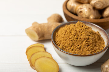 Fresh ginger on wooden background. Dry ginger. Sliced ​​ginger with honey and lemon. Ginger...