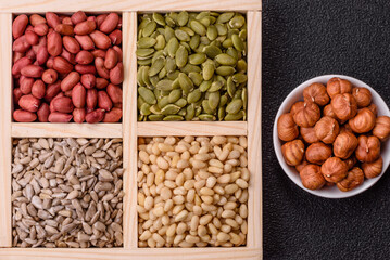 A box of peanuts and cedar nuts and sunflower and pumpkin seeds