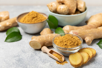 Fresh ginger on wooden background. Dry ginger. Sliced ​​ginger with honey and lemon. Ginger...