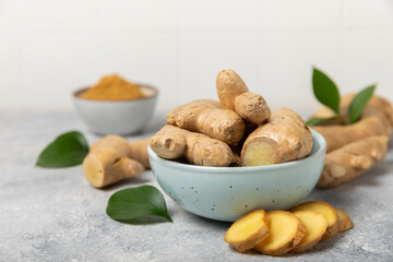 Fresh ginger on wooden background. Dry ginger. Sliced ​​ginger with honey and lemon. Ginger...