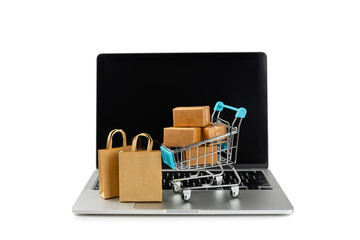 Online shopping concept.Cardboard box and shopping bags in a trolley isolated on white background....