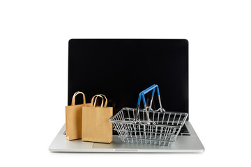 Online shopping concept.Cardboard box and shopping bags in a trolley isolated on white background....