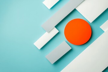 Artistic abstract composition with blue background, gray shapes, and a bright orange focal circle