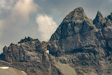 Fototapeta premium The Martinsloch is a breakthrough in the Tschingelhörner Alpine chain south-east of Elm in the canton of Glarus, in the form of an approximately 19 metre wide and 22 metre high triangle.