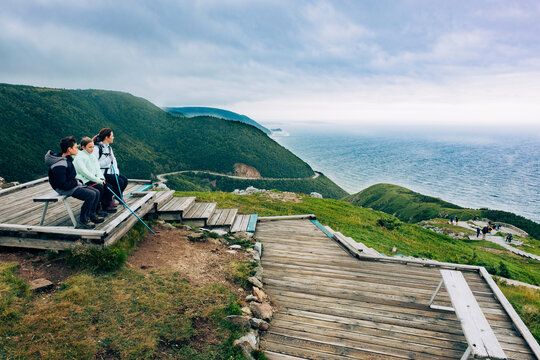 Family walking the Skyline Trailhead, Cabot trail, Cape Berton Island, Nova Scotia, Canada