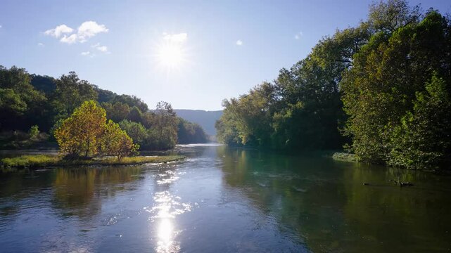Calm rural river during autumn surrounded by the Shenandoah Mountains. North Fork of the Shenandoah River.